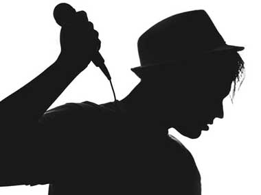 Silhouette of girl with microphone