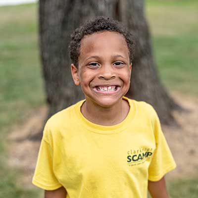 Kid at camp smiling